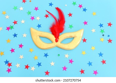 Holidays image of mardi gras masquarade venetian mask over blue background. view from above