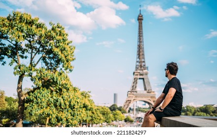 Holidays in Paris. Man enjoying Paris, France. Summer vacation in Europe. Eiffel Tower. - Shutterstock ID 2211824297