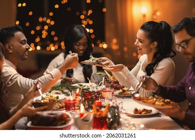 Holidays, Party And Celebration Concept - Multiethnic Group Of Happy Friends Having Christmas Dinner At Home