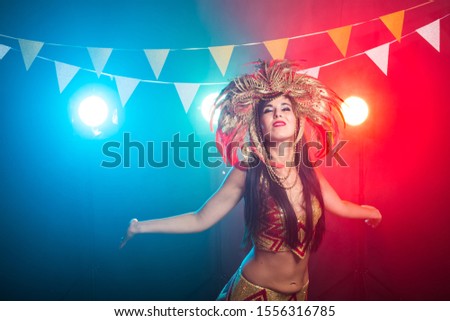 Holidays, party, dance and nightlife concept - Beautiful woman dressed for carnival night