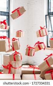 holidays, presents, new year and celebration concept - big pile of gift boxes with red ribbons on white bricks background