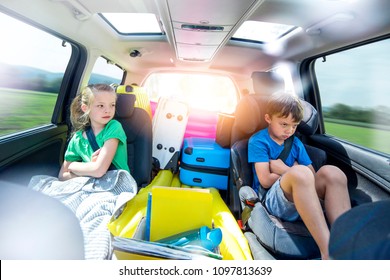 Holidays - Siblings Arguing In The Car During A Long Car Journey