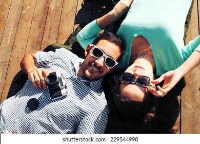 Holidays, Vacation, Love And Friendship Concept - Smiling Fashion Couple Having Fun Outdoors. Man With Girl In Spring Urban Style. Photo Toned Style Instagram Filters.