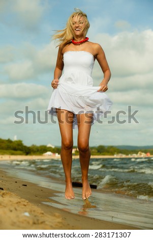 Similar – Young, long-legged, slim woman on the beach