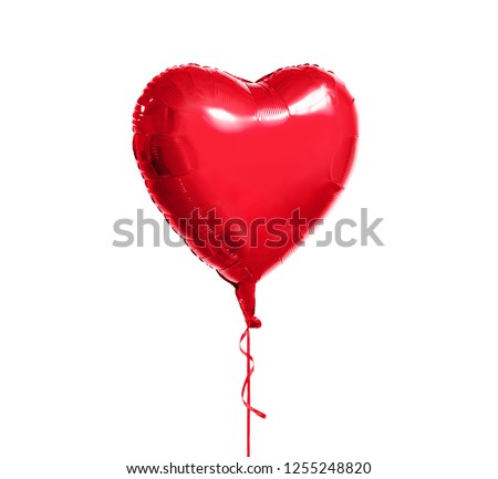 holidays, valentines day and party decoration concept - metallic foil red helium heart shaped balloon over white background