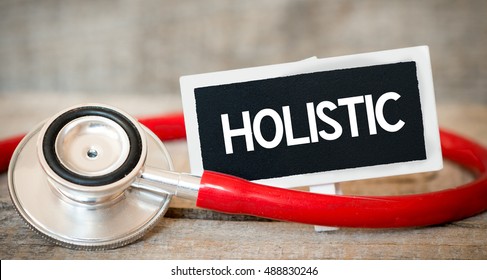 Holistic / Blackboard With Word Holistic And Stethoscope. Medicine Concept.