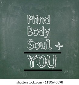 Holistic  Health Concept With Text Written On Chalkboard. Mind Body Soul Equals You.