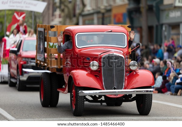 Holland, Michigan, USA - May 11, 2019: Tulip Time\
Parade, Old Meijers Chevrolet Truck, going down the road during the\
parade