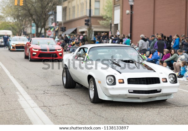 Holland, Michigan, USA - May 12, 2018 Chevrolet\
Camaros going down the road at the Muziek Parade, during the Tulip\
Time Festival