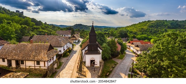 Holloko, Hungary - Aerial panoramic view of the traditional village centre of Holloko (Raven-stone), an UNESCO site in Hungary on a sunny summer day - Shutterstock ID 2054842847