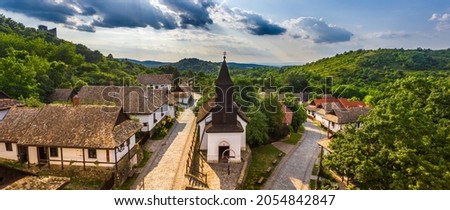 Holloko, Hungary - Aerial panoramic view of the traditional village centre of Holloko (Raven-stone), an UNESCO site in Hungary on a sunny summer day