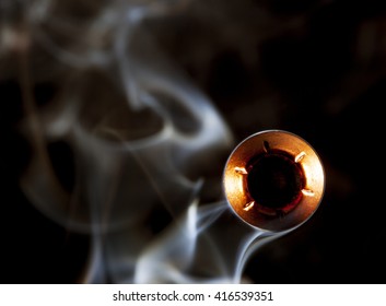 Hollow Point Bullet That Is Coming At The Viewer With Smoke