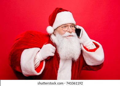 Holly jolly x mas! Funny santa in headwear, costume, black belt, white gloves brings gifts for kids, ready, prepared to celebrate, sale promotion, winter december, chatting on telephone - Powered by Shutterstock