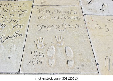 HOLLYWOOD - CALIFORNIA, AUG. 15, 2014: Hand And Foot Imprints With Inscription In Concrete Of Famed Movie Star Gregory Peck At Graumans Chinese Theater In Hollywood, California USA
