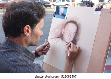 HOLLYWOOD, CALIFORNIA - NOVEMBER 13 2016: A Street Painter Sketching Robin Williams's Portrait On November 13, 2016 In Hollywood, CA.