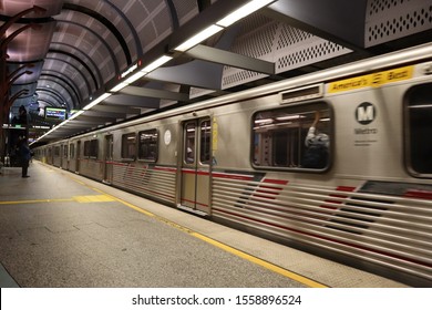 Hollywood, California: October 6, 2019: view on the track of Hollywood/Highland Metro Rail Station with the train moving