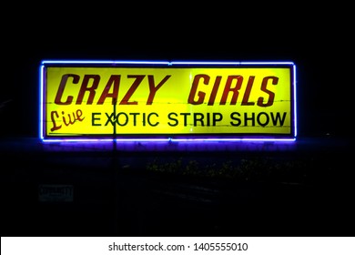 HOLLYWOOD, CALIFORNIA / USA - AUGUST 30 2004: Lighted Sign For Crazy Girls Live Exotic Strip Show On N La Brea And W Sunset Blvd. In Hollywood At Night.