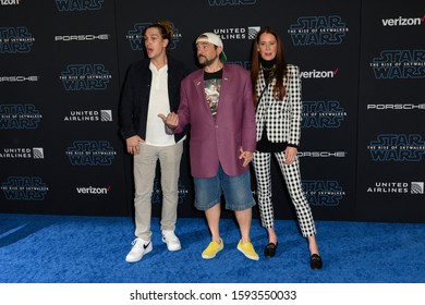 HOLLYWOOD, CALIFORNIA / USA - DECEMBER 16, 2019: Actor Jason Mewes (L), Director/writer Kevin Smith (m) And Producer Jennifer Schwalbach Smith (r) Attends The Premiere Of Disney's 