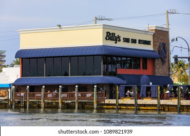 HOLLYWOOD, FLORIDA, USA - MAY 12, 2018: Image Of Billys Stone Crab Restaurant Hollywood Beach Florida On The Intracoastal Waterway With Boat Parking