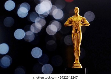 Hollywood Golden award statue on black background with copy space. Success and victory concept.