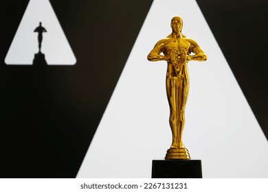 Hollywood Golden Oscar Academy award statue on white and black. Success and victory concept.