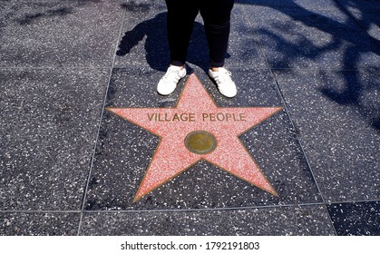 Hollywood, Los Angeles/US - June, 2014. Tourist On Village People Star On The Walk Of Fame, In Hollywood. 