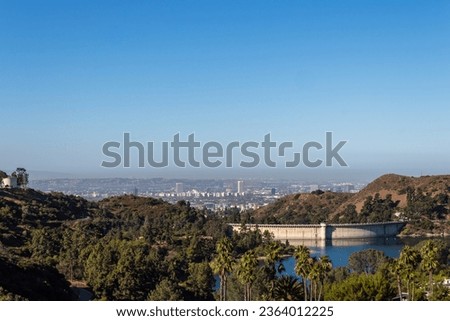 Hollywood Reservoir behind Mulholland Dam, in the Hollywood Hills, situated in the Santa Monica Mountains and north of the Hollywood neighborhood of Los Angeles, California.