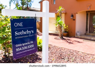 Hollywood, USA - May 6, 2018: Sotheby's Real Estate Agent Sign Text On Street During Sunny Day In Florida East Coast In North Miami Beach Background Of House