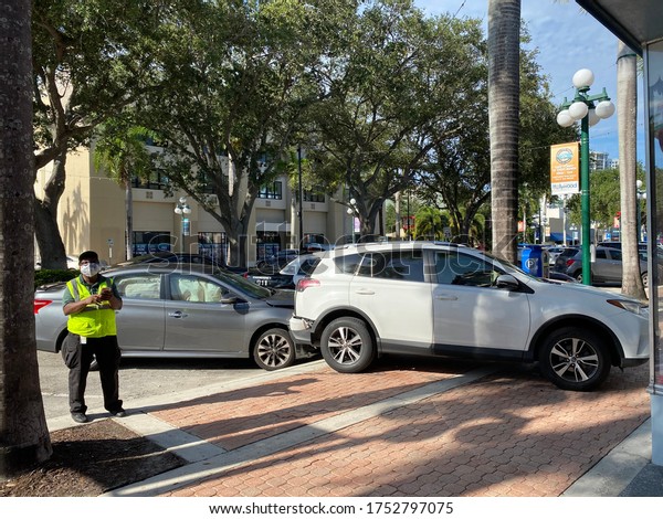Hollywood,Florida/USA-06/09/2020: Parked car\
hit in downtown Hollywood parked car end up on\
sidewalk.