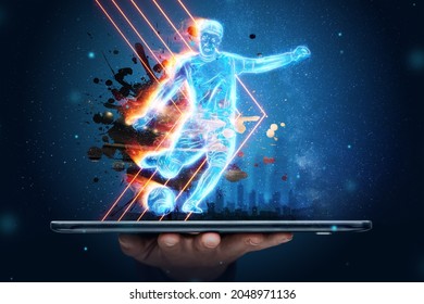 A hologram of a football player running out of a smartphone screen. The concept of sports betting, football, gambling, online broadcast of football - Powered by Shutterstock