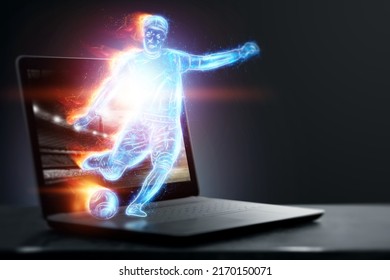 A Hologram Of A Soccer Player Running Out Of A Notebook, Laptop Screen. The Concept Of Sports Betting, Football, Gambling, Online Broadcast Of Football