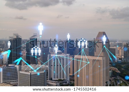 Hologram of social media icons over sunset panoramic cityscape of Singapore, Asia. The concept of people connections. Multi exposure.