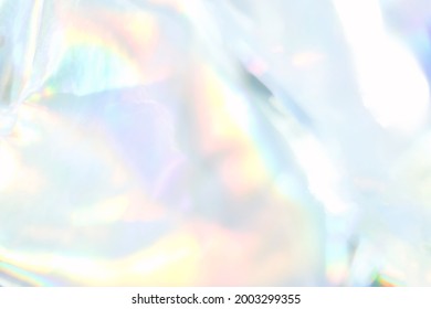 holograph foil background. Pastel color paper. Retro trend design. Vintage fantasy cover. Chrome holo art. Modern effect. Rainbow metallic material. Fabric glitch - Shutterstock ID 2003299355