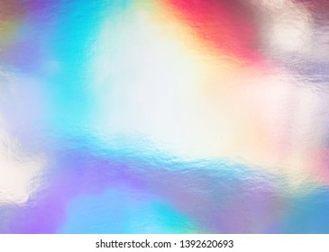 Holographic Foil Paper Close-up. Modern Trendy Colorful Background