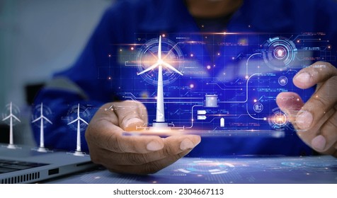 A holographic graphic screen that displays the electrical power generated by wind turbines and analyzes the data through artificial intelligence AI. Clean energy technology and renewable energy. - Powered by Shutterstock