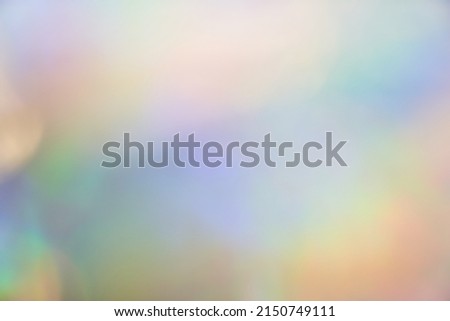 Holographic iridescent background, abstract rainbow blurred background. Texture with multicolours in 90's style. . High quality photo