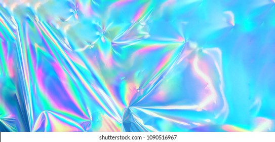 Holographic iridescent surface wrinkled foil pastel. Real Hologram Background of wrinkled abstract foil 80s texture with multiple colors. 90s aqua menthe cyan pastel holographic gradient mesh template