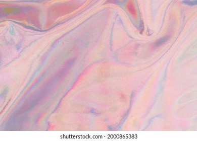 Holography Cloth Texture In Pastel Purple Pink Colors. Holographic Pale Pink Color Wrinkled Pearlescent Foil. Holographic Iridescent Light Rose Gold Rainbow Fabric Abstract Background.