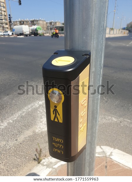 HOLON, ISRAEL. July\
02, 2020. Blind and deaf-friendly push to walk mechanism at the\
crossroad in Israel.