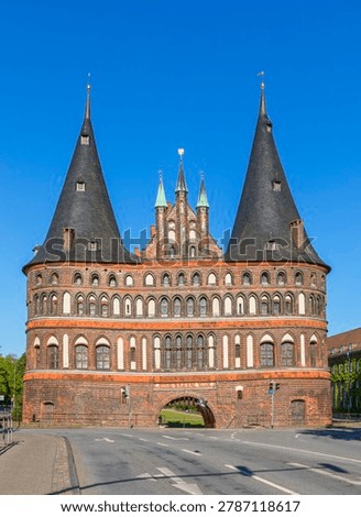 Holsten gate at Lübeck, Germany, view from the bridge crossing Trave river at the old town