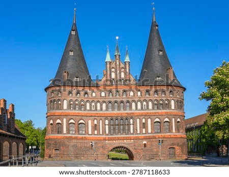 Holsten gate at Lübeck, Germany, view from the bridge crossing Trave river at the old town