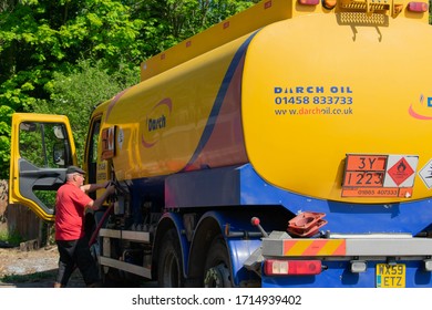 Holton, Somerset / United Kingdom - April 26 2020: A Man Delivery Heating Oil To A Home In Somerset During The UK COVID-19 Lockdown While Oil Price Is At All Time Lowest Price