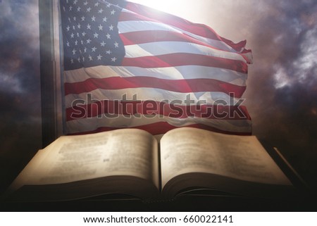 Holy Bible with the american flag in the background.