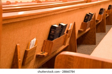 Holy Bible In The Back Of A Pew In A Sanctuary