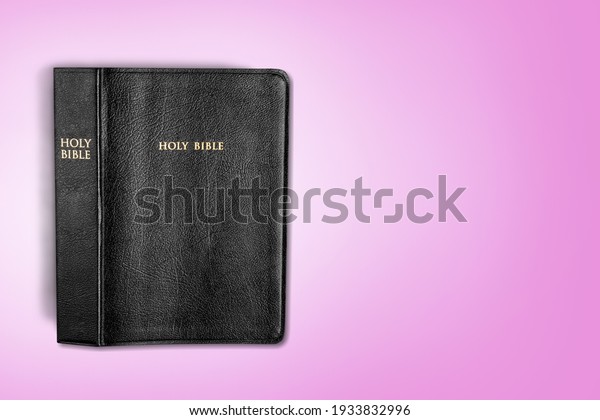Holy Bible book for pray on\
desk