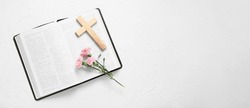 Holy Bible, Cross And Flowers On Light Background With Space For Text