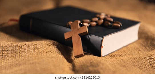 Holy Bible and Cross on Desk - Shutterstock ID 2314228013