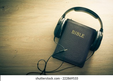 Holy Bible With Headphones - Symbol Of Listening To The Word Of God.