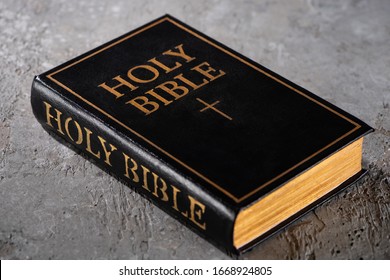 holy bible on grey textured surface