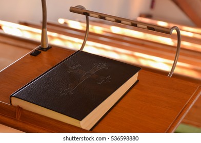 A Holy Bible on a pulpit in a church waiting for the preacher or pastor  - Shutterstock ID 536598880